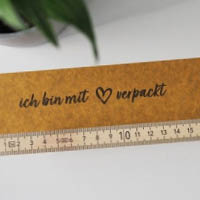 Papier Klebeband mit vorgedruckten Motiven für eine emotionale Kundenansprache Papier Klebeband mit den Motiven "mit Liebe verpackt" und "vielen Dank für deine Bestellung"